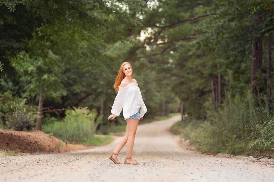 Bremen senior portrait photographer, teen walking on country road in summer