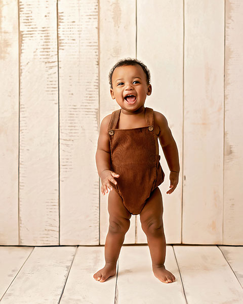 Fairburn baby photographer, smiling baby boy with simple wood backdrops