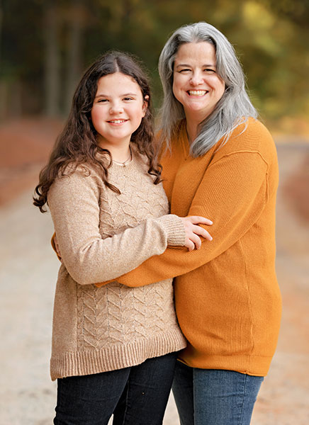 family photographer near Newnan, mom and teen daughter outside