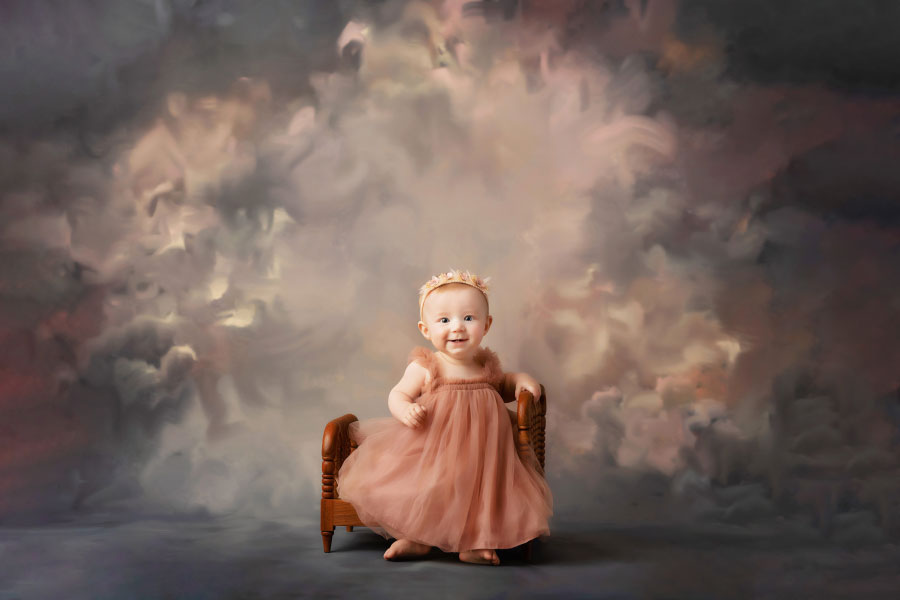 Hiram baby photographer, girl on bed prop for studio milestone session