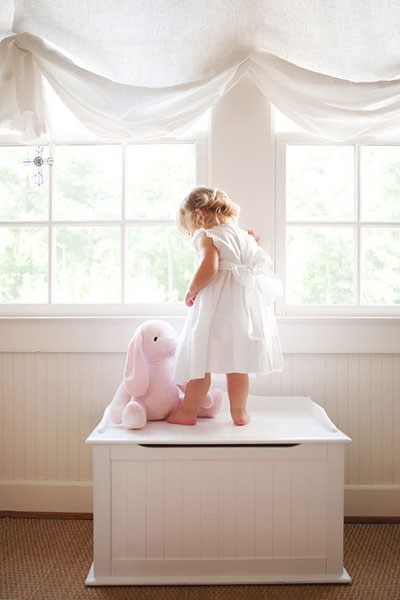 Newnan baby photographer, girl by windows during in-home session