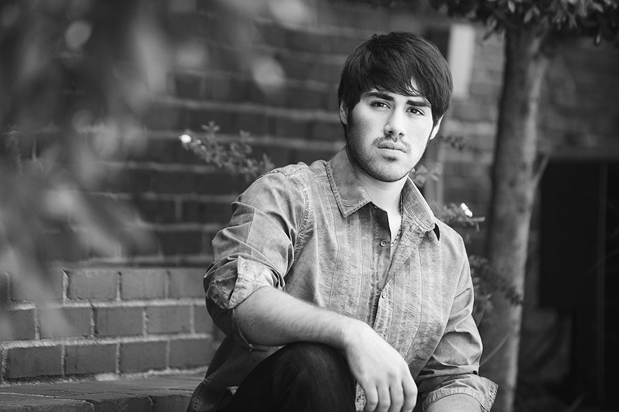 Newnan senior portrait photographer, teen downtown by brick wall