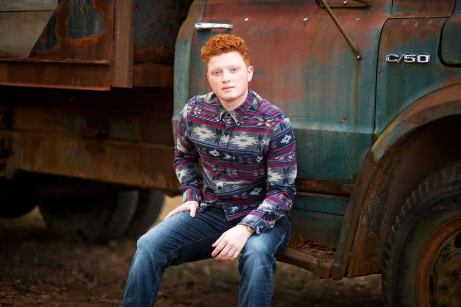 senior portrait photographer near Carrollton, GA; teen on vintage truck