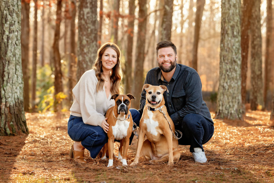 Tyrone family photographer, couple outside with two dogs