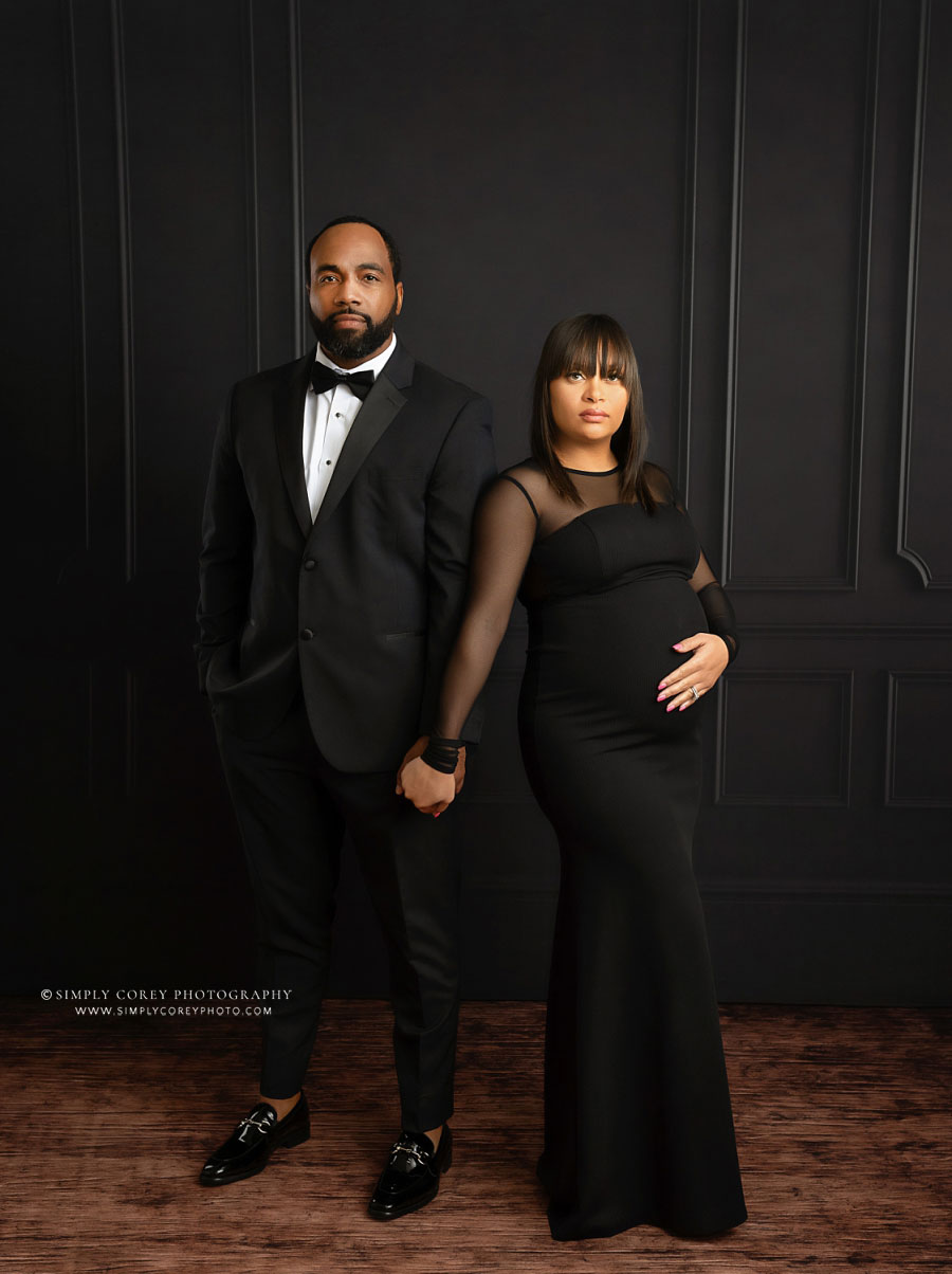 Atlanta maternity photographer, formal studio portrait on black backdrop