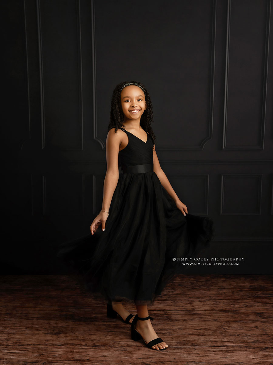 Villa Rica children's photographer, formal studio portrait on black backdrop