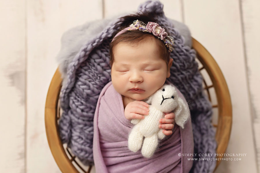 Villa Rica newborn photographer, baby girl in lavender holding a bunny
