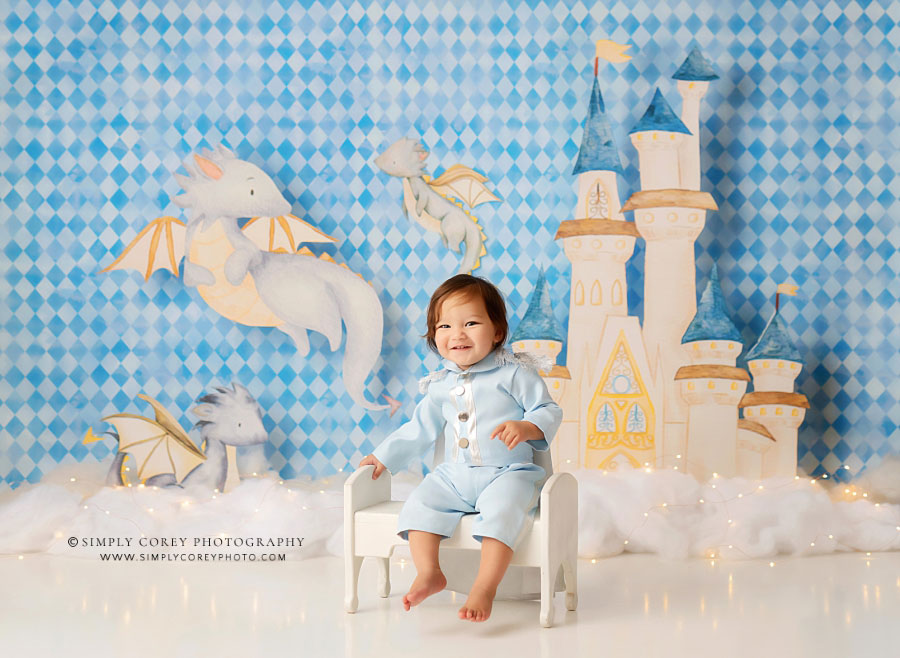 baby photographer near Newnan, blue studio set with castle and dragon