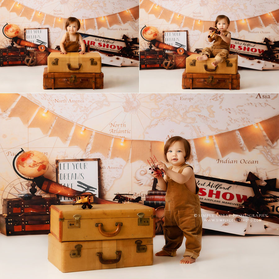 baby photographer near Villa Rica, boy with suitcases with travel studio theme