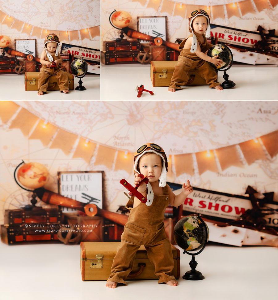 Douglasville baby photographer, boy with airplane on travel studio set