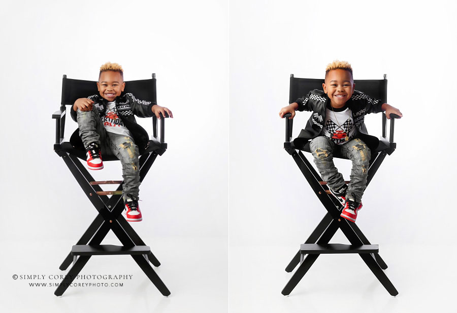 Douglasville children's photographer, boy in director's chair on white studio backdrop