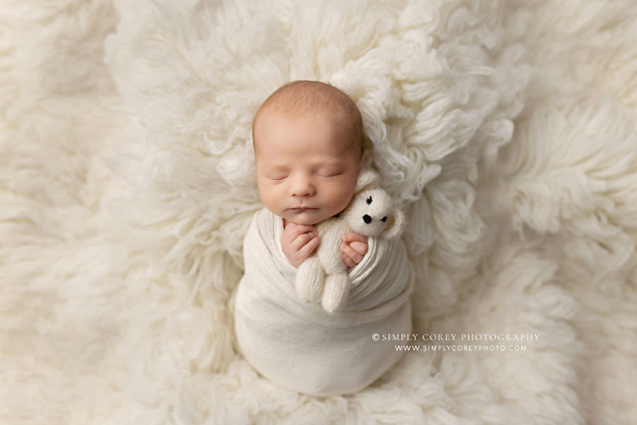 newborn photographer near Peachtree City, baby boy on off white flokati fur